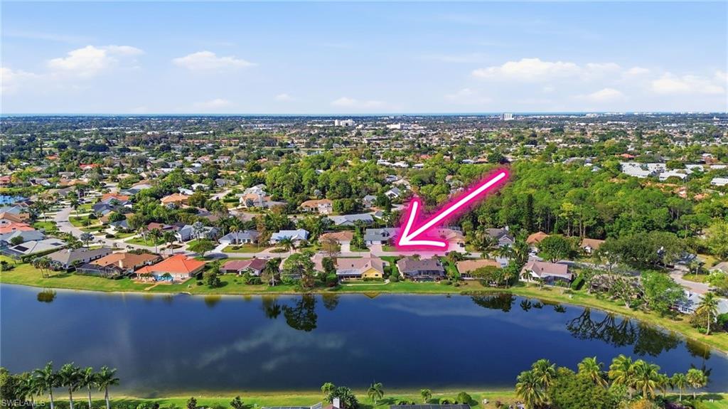 One or more photo(s) has been virtually staged, AI generated or rendered.  This Kings Lake home offers true peace of mind, generous living space, and beautiful lake views. With 4 bedrooms, 3 full bathrooms, and approximately 3,500 square feet, it is one of the larger homes in the community, which also offers some of the lowest HOA fees you'll find in Naples. The heavy lifting has already been done with recent updates including a 2021 roof, 2020 water heater, 2020 main AC, 2022 split AC system, hurricane impact windows, doors, and skylights, plus a whole-house generator. As an added bonus, the seller is willing to transfer the current flood insurance policy, allowing the next owner to benefit from a lower flood insurance rate. Inside, you'll find generous living spaces designed for everyday comfort and entertaining. The Florida Room is the standout feature, offering panoramic lake views and a true extension of the living space. Enjoy your morning coffee, host family and friends, or simply relax and take in the view. This is a room you'll use year-round. The kitchen features granite countertops, custom cabinetry, abundant storage, and thoughtfully designed workspaces that make it both functional and inviting. Just minutes from downtown Naples and the beach, this home offers a rare opportunity to make it your own while starting with many of the major improvements already in place.