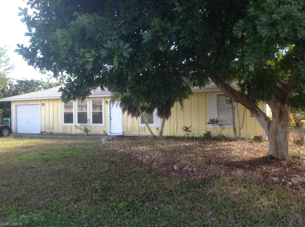 Great corner lot surrounded by trees! 3 bedroom, 2 baths with screened lanai. Plenty of room for a pool. 2 car garage and laundry room. Home definitely feels larger than square footage stated. Well and septic.