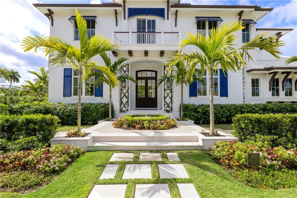 Spectacular British West Indies jewel offers high design in the walkable center of downtown Old Naples! Walls of glass and Southern exposure provide sun lit rooms for the ultimate Florida living. Perfectly situation on a quiet corner, this home offers timeless furnishings, a spacious great room, sparkling kitchen, decorative bar with wine cooler, ice maker and drink drawers, 5 bedrooms en suite, powder plus pool baths, office, 2 laundries, and elevator. A breath-taking Florida room encased in disappearing glass walls becomes magical outdoor living, open to the saltwater infinity pool, patio and gardens. A seamless indoor-outdoor ambiance floods the entire home, while the Florida room fireplace creates a cozy comfortable atmosphere. The spacious kitchen provides Wolf gas range, Sub-Zero, 2 dishwashers, warming drawer, steam oven, microwave, and coffee bar.  The upstairs gathering loft hosts TV, bar service, smart house and glorious sunbathing balcony. Walk everywhere!! 3 short blocks to 5th Ave and 3rd St, Naples sugar sand Beaches, Cambier Park Tennis, Art shows, Boat Docks, and Fishing at the Pier! End the beautiful day at home relaxing in the garden around the dancing firepit.