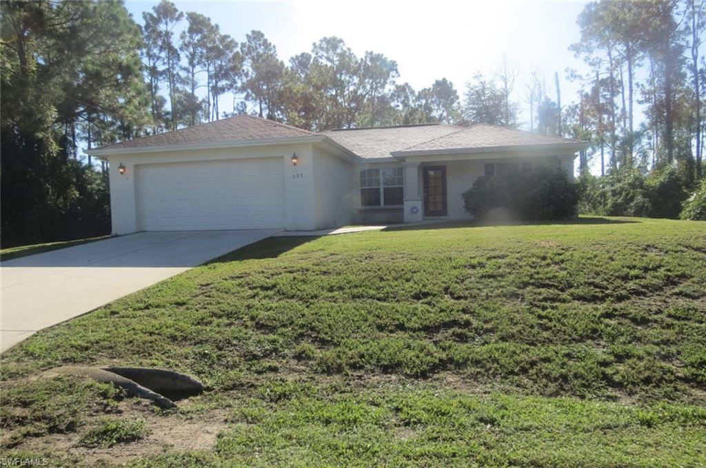 You'll love this one, nestled into a quiet neighborhood with 3 bedrooms, 2 baths and 2 car garage.   Updated light fixtures and ceiling fans, spacious screened in lanai to keep out the critters while you relax with your coffee. Location is just a few miles from the grocery stores, schools and airport is 20 minutes away. Great price so it won't last long!