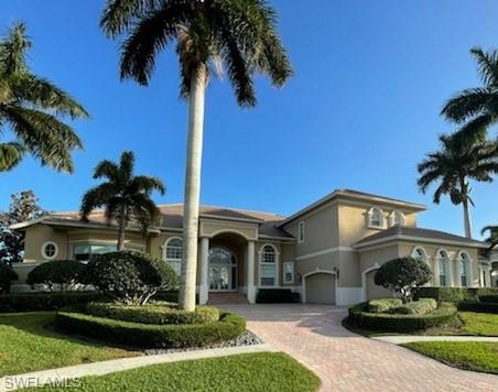 Priced to sell. Luxurious estate home with expansive water views of Robert's Bay and access out to the Gulf of Mexico can be yours. Owner's paid 3.3 back in "17 and just paid 90k for a new roof.  Enjoy spectacular views of the Bay from your elegant living areas throughout the home. A few features of the interior include bright natural light, diagonal tile, designer ceiling treatments, columns, faux finishes, and archways. Kitchen area includes beautiful cabinetry and light granite with matching Island. The den has gorgeous wood panel. Master bedroom is on the ground floor with amble room for a sitting area and water views and access to the pool area. Master bath includes Roman columns and a soaking tub with dual sinks and a bidet. Upstairs loft area also has a small kitchen and balcony overlooking pool and water view.The lanai has a spectacular pool/spa and a full outdoor kitchen with spacious sitting area. Octagon dock to fish off of, which is adjacent to the dock and boat lift. New roof installed. This estate home sits on a meticulously manicured landscaped lot.  Easy access to the beach and restaurants and shops.  Call today to get your personalized tour.