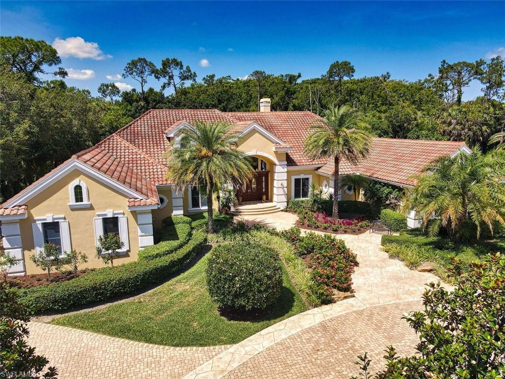 The moment you enter this palatial Arthur Rutenberg home, you will appreciate the quality design, workmanship and elegance of this grand estate. Pool and Preserve view are to die for. Large lot over one acre. 
The living area includes a fireplace; pizza oven, overlooks of garden/pool area featuring artistic statuary, waterfalls and spa. There is elevated covered walkway out to the 1,000 square guest house where it an be used as an exercise room, game room, spare  bedroom or studio. The master suite with private garden area features an exquisite marble bath. Each guest bedroom has its own bath. The kitchen features Silestone quartz countertops, handmade Italian  ceramic tile backsplash accent. Second floor has an enormous bedroom suite and bath with balcony. Large fenced tropical fruit tree garden with mature figs, mangos, avocados, pineapple, lemon and bananas. Two - 2 car garages, one is air conditioned! 
Quail West is among SW Florida's most exclusive communities with two 18-hole golf courses, clubhouse, tennis, full service spa, fine dining and numerous amenities. Unlike most home in Quail West a golf membership is not mandatory, however both Golf and Social Memberships are available.