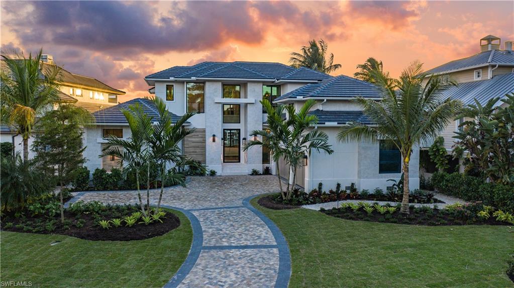 California Coastal developed by D.O. Allen Group, LLC, built by Wilbrett Construction Company, LLC and interiors designed by the Adelyn Charles Interiors team.  Boasting the prettiest long-water vistas in Aqualane Shores, overlooking Jamaica Cove and on into Jamaica Channel, the perfect backdrop for expansive indoor/outdoor living. The great room floor plan offers open living spaces naturally suited for entertaining.  This fully furnished smart home will feature handcrafted Ruffino cabinetry, high quality millwork, wood flooring throughout, Wolfe/SubZero appliance package, and high impact-resistant windows and doors. The Chef-style kitchen is graced with a convenient catering kitchen, and a fully stocked wet bar. The inspiring covered outdoor summer kitchen with living and dining areas are protected by motorized roll shutters and screens. The dramatic zero-infinity edged pool/spa is surrounded by an expansive pool deck. A coveted sundeck on the 2nd level for those amazing Naples' sunsets.   All set in a superb location, just a stone's throw from the beach and the celebrated 3rd Street South upscale shops and dining.