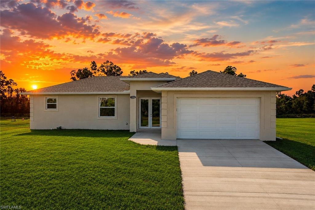 NEW AND IMPROVED PRICE! Located in a NON-FLOOD ZONE with HURRICANE IMPACT WINDOWS AND DOORS, this beautiful new construction home in Lehigh Acres offers the peace of mind every Florida buyer is looking for. Featuring 1,406 square feet of thoughtfully designed living space, this move-in ready home includes 3 bedrooms, 2 bathrooms, and a bright open-concept floor plan with HIGH CEILINGS and modern finishes throughout. The living areas showcase beautiful tile flooring, while the bedrooms feature durable, low-maintenance flooring. The kitchen is the centerpiece of the home, complete with stainless steel appliances, upgraded cabinetry, gorgeous countertops, and a large center island that's perfect for everyday living. Conveniently located near SR-82, shopping, dining, schools, and just a short drive to Fort Myers, this home offers easy access to everything Southwest Florida has to offer. Whether you're a first-time homebuyer, looking for a primary residence, a seasonal Florida home, or an investment property with strong rental potential, this home checks all the boxes. New construction homes in Lehigh Acres with impact windows, NO FLOOD INSURANCE REQUIRED, and this level of quality don't stay on the market long. Schedule your private showing today!