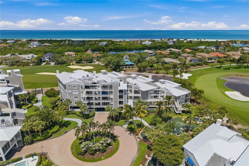 Enjoy single-family-style living with the ease of luxury condominium living in Habitat at Hideaway Beach. This spacious three-bedroom, three-bath end-unit residence, accessible by stairs and elevator, showcases an inviting open floor plan designed for everyday living and entertaining while enjoying serene views overlooking the newly redesigned golf course, scheduled for completion in fall 2026. Beautifully updated and designer-furnished, this bright and airy residence has been thoughtfully renovated to enhance style and functionality, creating an exceptional retreat. Inside, tile flooring flows throughout the main living areas, complemented by plantation shutters, elegant tray ceilings and a dramatic vaulted ceiling in the living room. Expansive sliding glass doors welcome abundant natural light into the living and spacious TV area, while the integrated lanai seamlessly extends the living space, creating an inviting retreat to enjoy the peaceful setting year-round. The spacious, open kitchen is ideal for cooking and gathering with family and friends, featuring abundant cabinetry, elegant new island seating and a dining area designed for entertaining. Premium appliances include a Bosch wall oven and convection cooktop (with convection cookware if sold furnished), a Frigidaire refrigerator/freezer with icemaker, and wine cooler. An inviting sitting area at the front entry offers a peaceful place to relax and enjoy the surroundings. The primary suite features a desk/office nook, dual walk-in closets, and a bright, spacious en-suite bath with glass shower, dual sinks, makeup station and enclosed water closet. The first guest suite offers a private en-suite bath and direct lanai access, while the generously sized second guest bedroom, large enough to accommodate two queen beds, also opens to the lanai. Another full bath and a dedicated laundry room with a laundry tub are adjacent to the hall. This residence also includes covered private and guest parking as well as a dedicated private storage closet. Residents enjoy the unparalleled Hideaway Beach lifestyle, a gated community renowned for exceptional amenities. Spanning more than 300 acres along the Gulf, Hideaway Beach offers over two miles of pristine white-sand beach and abundant outdoor recreation, including paddleboarding, fishing, shelling and more. The Habitat community also offers a dedicated private pool, hot tub and grilling area exclusive to its 52 residences. The newly completed 34,000-square-foot Sports and Wellness Center features state-of-the-art fitness facilities, dedicated Pilates and spin studios, spa-inspired locker rooms, five virtual hitting bays, and the Beachside Outfitters and Marketplace. Residents also enjoy tennis, pickleball, bocce, a nine-hole golf course and multiple dining venues at the Five-Star clubhouse overlooking the Gulf. This is an exceptional opportunity to enjoy one of Marco Island's sought-after luxury coastal lifestyles.