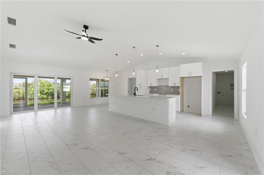 Welcome to this beautifully crafted waterfront home located at 10 NW 20th St in Cape Coral. Offering 4 bedrooms, 3 bathrooms, and 1,683 square feet of living space, this home combines modern finishes with Florida waterfront living.
Step inside to discover an open-concept floor plan featuring tile flooring throughout for easy maintenance and a seamless, elegant look. The spacious kitchen is designed to impress with quartz countertops, soft-close cabinetry, ample storage, and a layout perfect for both everyday living and entertaining.
The primary suite offers a private retreat with an ensuite bath, while the additional bedrooms provide plenty of space for family, guests, or a home office. Three full bathrooms ensure comfort and convenience for everyone.
Enjoy relaxing mornings and sunset evenings from the screened lanai overlooking the canal. With waterfront access and a desirable Cape Coral location, this property offers the perfect blend of comfort, style, and outdoor living.
Whether you're searching for a primary residence, seasonal retreat, or investment opportunity, this move-in-ready waterfront home is one you won't want to miss. Schedule your private showing today!