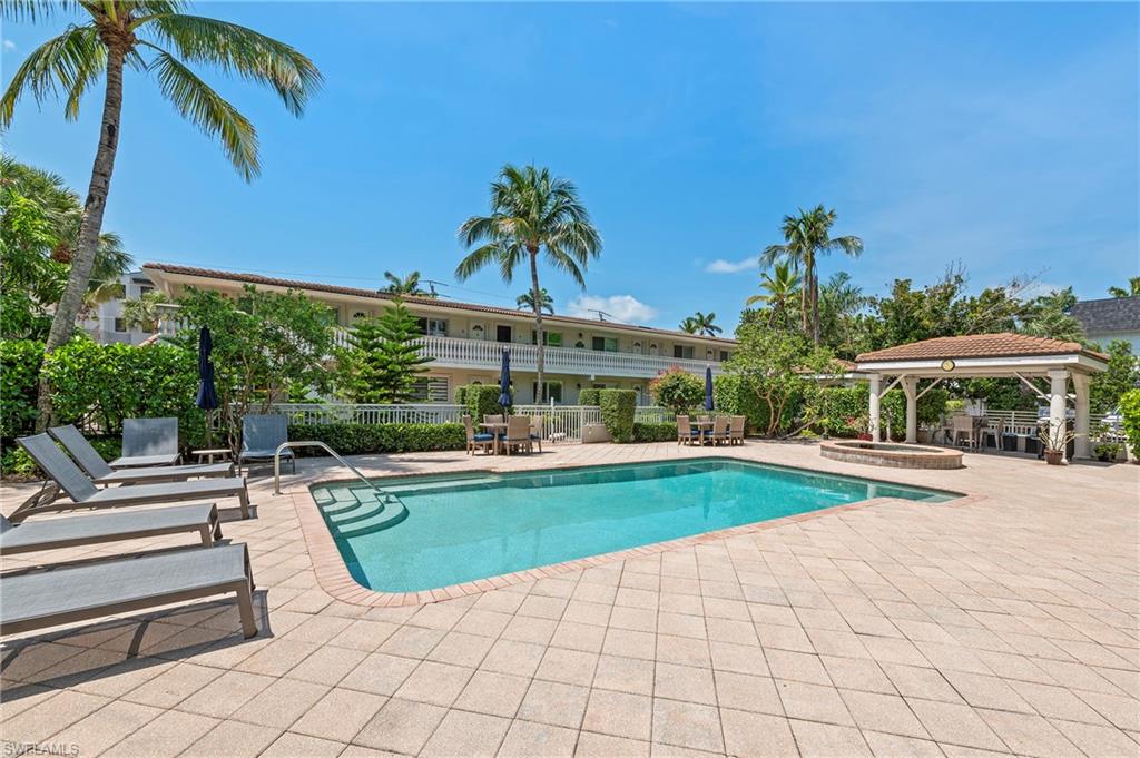 Seasonal Rental Condo in Prime Olde Naples Location Castleton Gardens. Discover the charm and convenience of Olde Naples living in this beautifully remodeled condo located in the highly sought-after, gated community of Castleton Gardens. This turnkey residence offers a bright, open layout with brand-new furnishings, updated appliances, and the added convenience of in-unit laundry. Designed for comfort and style, the condo features a well-appointed kitchen, spacious bedroom, and a private outdoor space perfect for relaxing or entertaining. Set within a serene banyan tree-lined courtyard, Castleton Gardens offers exceptional amenities including a large heated pool, rejuvenating hot spa, shaded gazebo, and a BBQ grilling area. The community's tropical setting and resort-style features create the ideal atmosphere. Unbeatable location just three blocks from 5th Avenue South's world-class shopping and dining, two blocks from Cambier Park, and one block from the waterfront shops and restaurants of Tin City. The Syren Oyster and Cocktail bar very close as well. Naples' white sandy beaches are also just minutes away via scenic residential streets. Featuring in-unit laundry too. Enjoy the best of coastal Florida living in one of Naples' most desirable neighborhoods. Also, may be offered long-term.