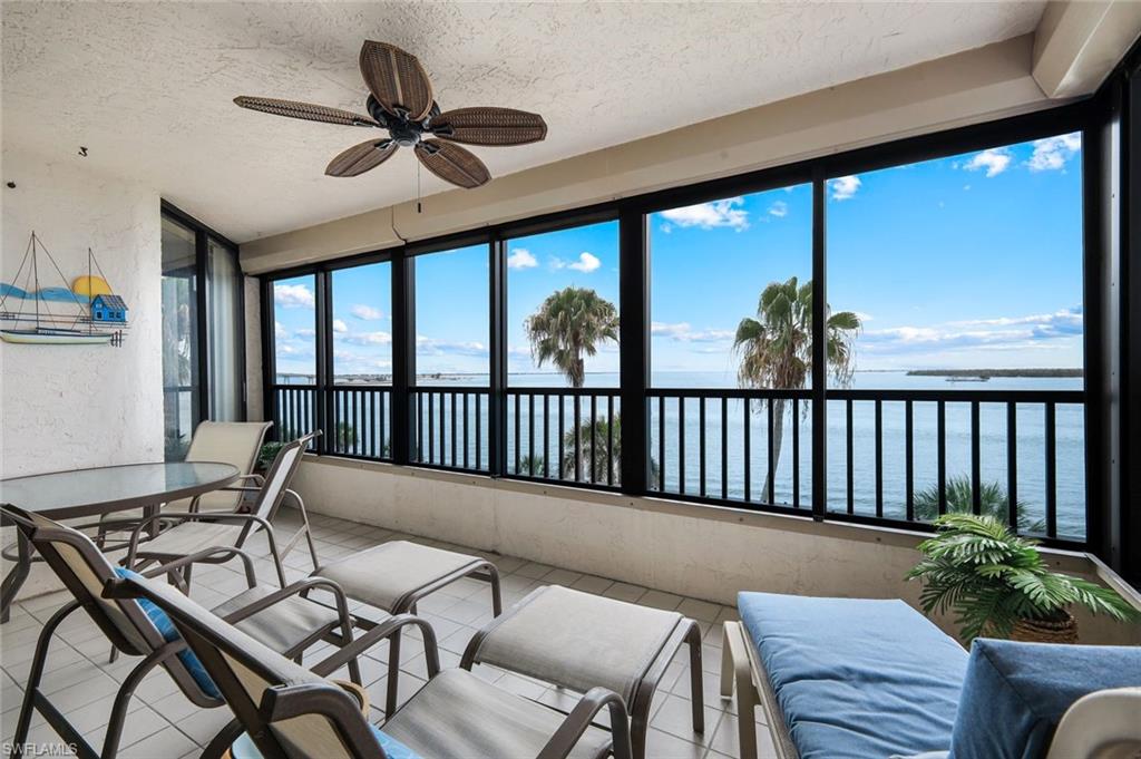 Spectacular bay views await from this ideally situated residence in Punta Rassa's premier center waterfront building. One of Punta Rassa's most cherished features is its mesmerizing sunsets, best enjoyed from your private lanai as the sun sets into the horizon beyond the tranquil waters and barrier islands. The updated kitchen offers both style and functionality, and the residence is offered turnkey furnished and move-in ready.

Designed for comfort and peace of mind, the lanai is equipped with storm shutters, while impact-rated glass protects the remainder of the home. Residents enjoy an exceptional collection of amenities, including a resort-style pool and spa, tennis and pickleball courts, shuffleboard, grilling areas, and more. Boating and fishing enthusiasts will appreciate the unrivaled waterfront setting and easy access to some of Southwest Florida's most sought-after fishing and boating destinations.

Additional highlights include on-site property management, scenic waterfront walking paths, and proximity to the Sanibel Harbour Yacht Club, where boat slips may be available for separate purchase. The property also offers private and community storage areas, as well as covered and open parking options. New sod and landscaping are currently being installed, further enhancing the beauty and appeal of this waterfront community.

Whether you're seeking a full-time residence, seasonal retreat, or investment opportunity, this exceptional bayfront property offers the perfect blend of breathtaking views, resort-style amenities, and the relaxed coastal lifestyle that makes Punta Rassa so special.