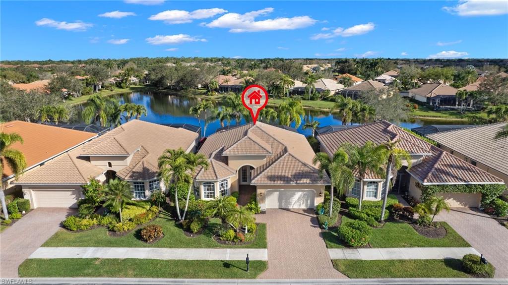 Located in the sought-after gated community of Masters Reserve, this pristine home seamlessly blends elegance and functionality.  Step through the welcoming double doors of this immaculate home and  you're greeted by a large family room with soaring 12-foot ceilings, an expansive wall of sliding doors, and hardwood floors that flow into a well-equipped kitchen and dining area with charming bay windows.  Beyond the family room and kitchen, enjoy your private custom pool and lanai featuring covered dining area overlooking beautiful southeast lake views. Special features include: single owner, exterior and lanai freshly painted 2023, new lanai screens 2023, electric storm shutters on lanai and front entry of the home, newly landscaped backyard.  The Player's Club & Spa offers first class amenities, including resort-style pool, fine dining, clubhouse with fitness center and spa, and three golf courses.  Whether you seek a tranquil retreat or a vibrant lifestyle this beautiful home is the perfect choice.