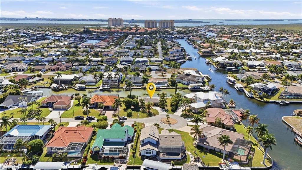 PRICE IMPROIVEMENT!! INCREDIBLE LOCATION TO BUILD YOUR DREAM HOME ON AN OVERSIZED SOUTH FACING LOT!! The previous home has already been demolished, giving you a clean slate to design exactly what you want. Even better, because a home previously existed on the property, there are no impact fees to build here. This magnificent .35-acre oversized canal front location in one of the most desirable locations in Cape Coral. Enjoy a short boat ride with direct access to the river and Gulf with no bridges or locks. This location offers outstanding canal views and a southern rear exposure. Located in a fantastic neighborhood, with easy access to Tarpon Point Marina, Cape Harbour and Rotary Park. Endless possibilities with this location and lot size. The property offers exceptional flexibility and allows you to take advantage of the oversized lot to build a custom luxury residence tailored to your vision and lifestyle. Take advantage of this rare opportunity to own a piece of paradise in a great location that checks all the boxes including oversized property with 150’ of seawall frontage, South facing, direct access, wide canal and a short ride to open water. Do you have multiple boats? With 150’ of seawall frontage, building a dock to house multiple boats will not be a problem. This location is truly a must see! I will also be available to answer questions regarding the building process.