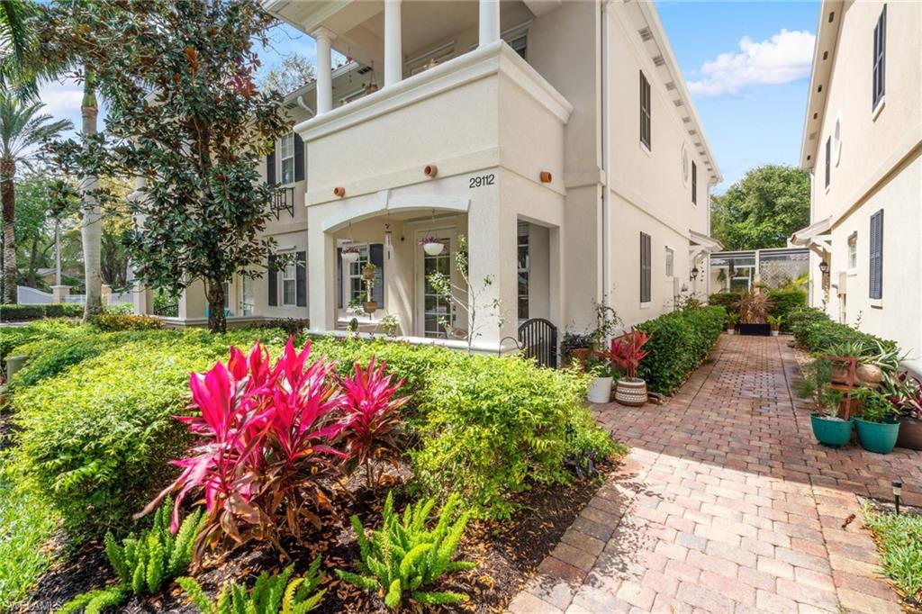 This home exudes beauty, inside & out. From the brick walkway & tree-lined street, the exterior is surrounded by tropical foliage. Step inside your 2 story light-filled abode w/ new paint, light fixtures, recessed lighting t/o & recent renovated kitchen & baths. The large open kitchen enjoys reclaimed wood shelving, gorgeous tile, & new ss appliances. Sip coffee on your front porch or private balcony & watch the sunrise, or dine al fresco on your lanai that lives like a second living space. Downstairs features an airy living & dining area w/ large 2nd master w/ walk-in closet & en suite bath. Upstairs, 2 additional bedrooms + spacious master suite that’s been newly updated w/ dual vanity, separate soaking tub & shower + walk-in closet & private balcony. The home enjoys an upstairs laundry room, huge walk-in closets in all bedrooms w/ built-in shelving & tons of storage space t/o home & garage. Central vac & storm shutters for peace of mind. San Remo is lovely & well-kept; great for strolls, enjoying wildlife, great amenities, & pool at the newly renovated clubhouse just a short way across the street.  5 mins to 75, 15 mins to the beach, 20 mins to RSW, & 25 mins to downtown Naples
