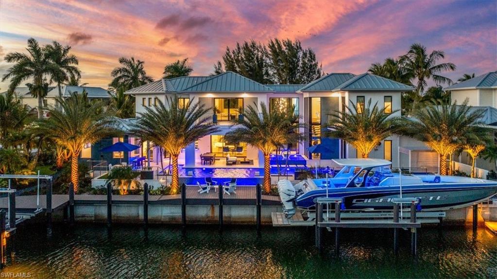 Located in the direct waterfront community of Royal Harbor sits this magnificent custom built home at 2201 Shad Court. This recently completed new home boasts 4175 sq ft under air with 6075 sq feet of amazing living space! The home  is situated on a quiet dead end street and offers preferred southern exposure with 155' on the water and direct waterfront Gulf of Mexico access! Built by the Williams Group this home has unsurpassed amenities (see Feature Sheet in supplements) and design features of the highest level. This thoughtfully conceived home features Wolf cooktop, Sub Zero fridge and freezer, and service kitchen. Lutron lighting system and Elan home control. New docks and two boat lifts with capacity up to 24,000 lbs. The guest suite allows private access and a separate alarm system for your guests and family! Immense outdoor living space and pool area with a landscape package of over 80 lights, creating the tropical paradise and your reality!