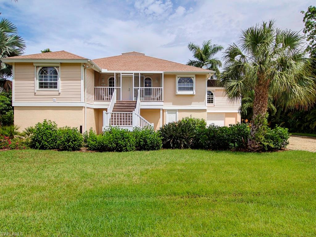 Sweeping lake and golf course views from this lovely home.  Located on Kittiwake Drive in the Dunes on Sanibel, a very private street, this lovely 3 bedroom, 2 bath plus den home with volume ceilings, wood floors, newly remodeled and raised pool and jacuzzi offers beautiful lake views.
