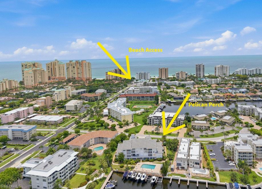 Experience the ultimate Marco Island boating lifestyle at Pelican Perch, where not only can you see your boat from the lanai, but your boat is also literally outside your back door, behind the building. This turnkey furnished two-bedroom corner residence offers long water views, a deeded dock and lift, assigned covered parking, and direct Gulf access, creating the perfect setting for those who want to enjoy life on the water. Ideally located just a short stroll from Marco Island's renowned South Beach, this pet-friendly tropical waterfront retreat seamlessly blends boating and beachside living. The spacious unit is filled with natural light and showcases beautiful water views throughout the main living areas. Residents enjoy covered parking, a welcoming social building with planned seasonal events and the convenience of keeping their boat directly outside their residence for spontaneous days on the water. Whether cruising to waterfront restaurants, exploring the Gulf and Ten Thousand Islands, or spending the afternoon on Marco Island's pristine crescent beach, this exceptional residence offers the quintessential island lifestyle in one of the area's most desirable boating communities. Seller financing is available for a 3 or 5-year balloon.
