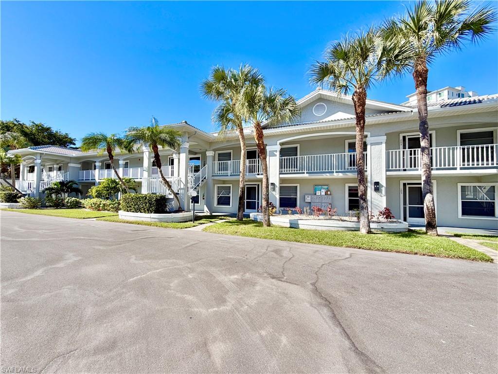 Enjoy the Naples lifestyle year round in this annual, furnished three bedroom, two bathroom first floor condominium located in Vanderbilt Villas, just off Vanderbilt Drive in North Naples. This residence offers a comfortable split bedroom floor plan with an open living and dining area, neutral finishes, updated wood look flooring through the main living areas and bedrooms, and a screened lanai that extends the living space outdoors. The home is furnished with living room, dining room, bedroom, and lanai furniture, making it well suited for everyday living. The kitchen features white cabinetry, granite countertops, a tile backsplash, and a practical layout with plenty of cabinet and counter space. The primary suite includes a walk in closet, an updated bathroom with dual sinks, modern fixtures, and a glass enclosed walk in shower. Two additional bedrooms provide flexible space for residents, guests, or a home office setup, and the second bathroom also features a glass enclosed shower. The residence includes a full sized washer and dryer inside the unit, assigned parking, and access to the Vanderbilt Villas community swimming pool. With Vanderbilt Beach, Delnor Wiggins State Park, Mercato, shopping, dining, Downtown Naples, and I-75 all within easy reach, this North Naples location makes it easy to enjoy the best of the area every day.