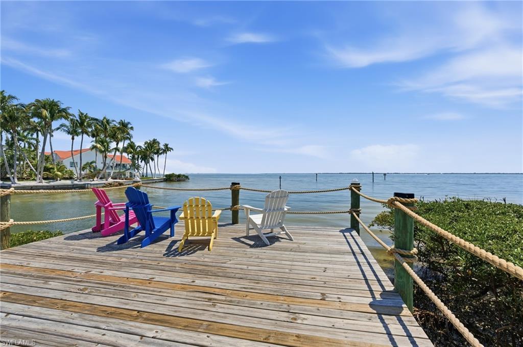 BAYFRONT!
Imagine ending your day with the sky stretching wide over San Carlos Bay, the lights of the Sanibel Bridge shimmering in the distance, and nothing but open water and gentle breeze in front of you. Life here feels calm, expansive, and deeply connected to the outdoors.
This home is perfect for someone who truly loves being on the water. Step outside to your dock and 10,000 lb boat lift (with water and electric), ready for morning fishing runs, sunset cruises, or quick trips to Sanibel and Cayo Costa. You’ll enjoy fast access to the Intracoastal Waterway and deep-water Gulf access just minutes away.
From the living area and screened balcony, the bay becomes part of your daily rhythm — shifting light, passing birds, and the gentle movement of the tide. Zero-corner sliding glass doors open the main living space completely to the outdoors, while electric screens can be raised or lowered for comfort, creating a seamless indoor-outdoor experience. Just steps away, an observation area offers the perfect spot to relax or wade into the water.
Inside, the home is beautifully updated. The kitchen features premium appliances including a Bosch refrigerator and dishwasher, Wolf microwave and stove, a pot filler, and a stylish Kraus farmhouse sink.
The main living level includes an open living space, the primary suite, and an elevator that runs from the carport entry level directly to the main floor for everyday convenience. The primary suite offers a spa-like bath with a clawfoot soaking tub, walk-in shower, and large closet. Upstairs, you’ll find two additional bedrooms and a spacious bath with a custom walk-in shower.
The ground level provides valuable flex space with epoxy flooring and EnduraFlood panels — ideal for storage, hobbies, or a game room. Electric storm shutters add extra convenience and peace of mind.
This turnkey home is located in St. James Place, a beautifully landscaped community of just 20 residences featuring a heated pool and spa. Tucked away on the southern tip of Pine Island, this is more than a home — it’s a true waterfront lifestyle.
Come see how different everyday life can feel when the bay is right outside your door.