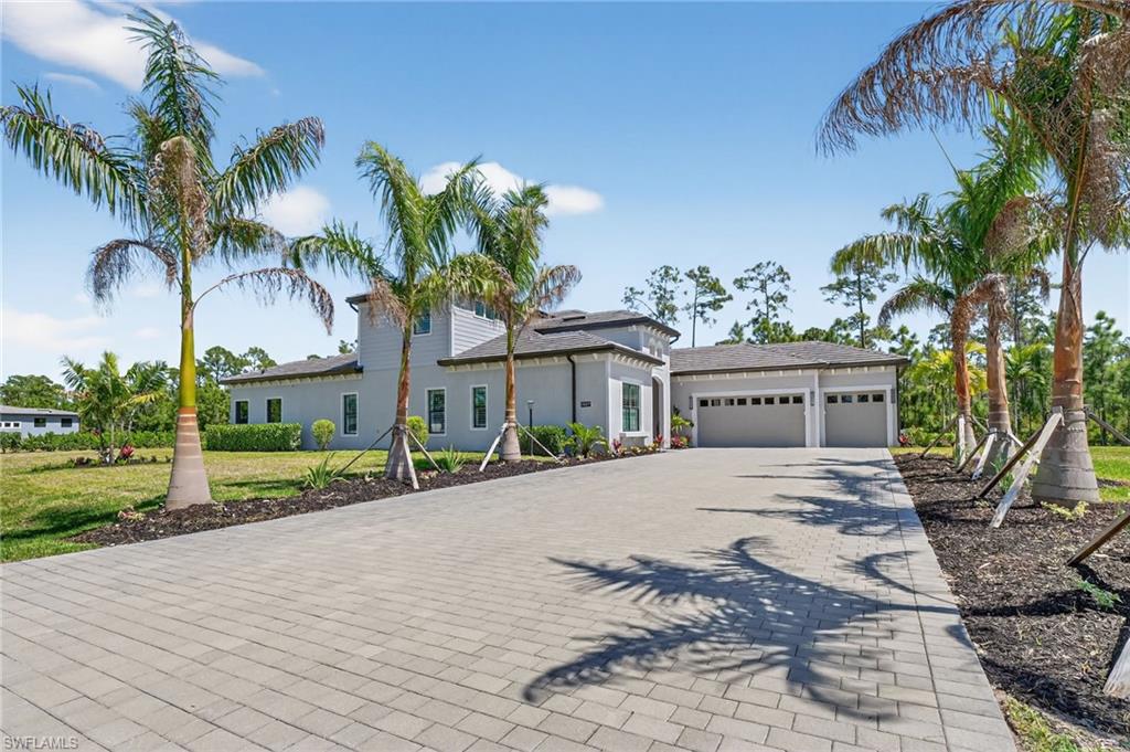 STUNNING ONE-OF-KIND ESTATE HOME W/ BUILDER/OWNER UPGRADES ($600,000+/-) 6 BEDROOM, 6 BATH, 3 CAR GARAGE WITH MULTI-GENERATIONAL DESIGN INCLUDING A "MOTHER-IN-LAW PRIVATE SUITE. Set on a private ONE ACRE preserve-view lot, this residence blends modern elegance with timeless comfort, delivering a lifestyle that’s both elevated and effortlessly livable. With a SIDE DESIGN ENTRY, IT CREATES A LARGE BACK YARD OPPORTUNITY, DIFFERENT FROM THE REST OF THE HOMES IN THE COMMUNITY. Open floor plan with 12' VOLUME CEILINGS custom "WOOD PLANK" ceramic tile flooring throughout the whole downstairs of the home for easy maintenance. "CHEFS KITCHEN WITH CUSTOM WOOD "WHITE SHAKER" CABINETRY, LEVEL 5 QUARTZ COUNTER-TOPS, SUB-ZERO STAINLESS STEEL APPLIANCES, LARGE ISLAND 12' WORK STATION AND FAMILY KITCHEN GATHERING SPOT w/6 stools, NATURAL GAS COOK-TOP WITH MULTIPLE OVENS AND LARGE WALK-IN PANTRY. From the moment you arrive, the home's impressive curb appeal is evident—enhanced by a paver driveway, manicured landscaping, and a grand covered entry. ALL WINDOWS AND SLIDERS ARE "IMPACT" STORM RESISTANT and make the home LIGHT-BRIGHT-SUNNY all year round and all windows have custom designer  plantation shutters and walls have decorative "WAINS COATING" finishes. MASTER BEDROOM has 12' volume traded  ceilings, HIS & HERS LARGE WALK-IN CLOSET W/ORGANIZERS, BATHROOM HAS A "SPA DESIGN" FEELING, DUAL QUARTZ VANITIES & SINKS, ROMAN SOAKING TUB AND HUGE "FRAME-LESS" GLASS WALK-THRU SHOWER. Also on the main level is a 2 guest bedroom SUITE with it's own private bath and entry, a den / extra bedroom, and the half bathroom. LAUNDRY ROOM IS A DREAM with DOUBLE WASHERS & DOUBLE DRYERS!  Upstairs, a spacious mother-in-law suite with its own upgraded kitchen area with quartz countertops, backsplash, and a gas cook-top offers a versatile space for entertaining or relaxing. An additional guest bedrooms and bathrooms complete the upstairs area. A LARGE EXTENDED PAVER LANAI WITH A CUSTOM "SOUTH BEACH" VIBE SUMMER KITCHEN FOR THOSE SPECIAL FAMILY GATHERINGS AND ENTERTAINING and offers additional beautiful preserve views, (this chef-inspired space showcases a premium stainless STEEL appliance package with built-in grill, side burner, sink, and refrigeration, beautiful stone masonry finishes, sleek granite counters, A SCREENED LANAI WITH A VERY SPECIAL ALUMINUM architectural FINISHED ceiling and vent hood system. THE GARAGE IS EXTENDED WITH FINISHED EPOXY FLOORS AND  220 AMP SERVICE. BIG BONUS, HOME HAS A GENERAC "WHOLE HOUSE" GENERATOR SAFETY SYSTEM FOR ANY STORM OUTAGES. HOME COMES WITH A COMPLETE ONE YEAR "HOME WARRANTY" FOR TOTAL BUYER COMFORT. "THIS IS A PREMIER GROUP" BEST LUXURY HOME VALUE PROPERTY OPPORTUNITY AND MUST BE SEEN BY ANY LARGE FAMILY BUYER GROUP!