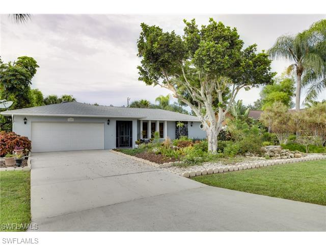This beautifully landscaped home is definitely a one of a kind in all of Cape Coral!!! As you meander up to the screened front entry, and walk through the front door, you'll experience a cozy, inviting feeling that will make you want to stay a while. The real hardwood solid hickory floors are not found in the average cookie cutter. The bedrooms feature berber carpeting and great walk in closets. The outside..........Very little lawn to cut here! This is an outdoor lovers paradise! You'll find 80 different kinds of plants and trees, 4 water features with a pond in the front yard, park like benches to sit and take all of this nature in with the privacy of your own home! The screened in lanai is huge also, so be prepared to entertain! Located just off of Del Prado and Hancock you'll find that convenience abounds! It is no more expensive to add a pool even with all of the landscaping. I have an estimate from a pool company.