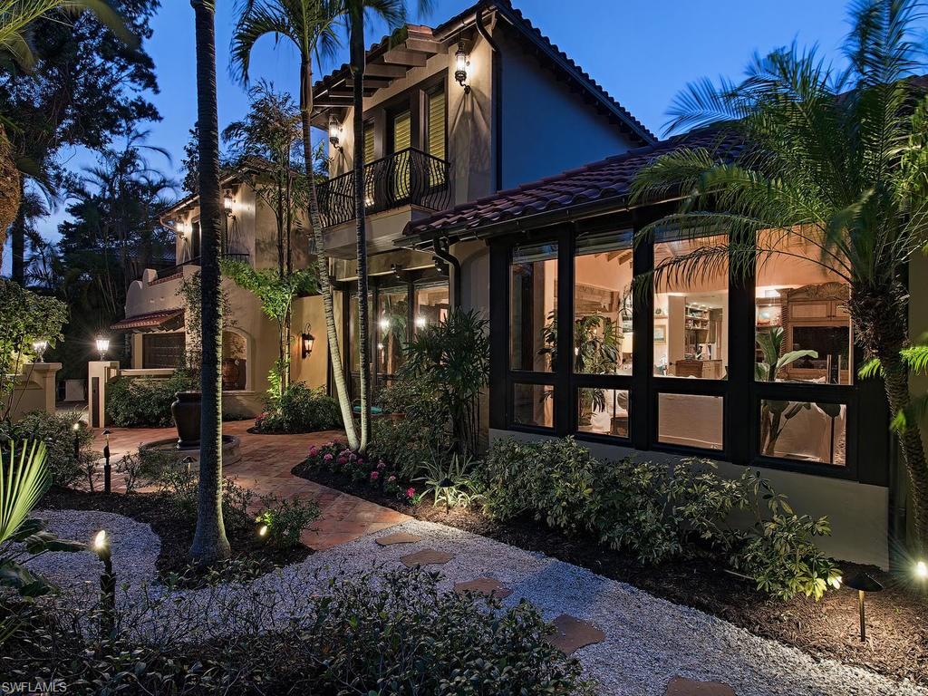 Welcome to Crackle Cottage, a well-kept Olde Naples secret! This enchanting property offers unique character while featuring recent renovations and a new second floor addition. Extraordinary beamed ceilings grace every room with beautifully detailed finishes throughout. The updated kitchen with Rookwood tile and stainless-steel appliances offer all the comforts of a modern kitchen, while still encompassing old world charm. Countless windows provide an abundance of light and private views of beautiful lush landscaping. The much-coveted downstairs master suite includes dual bathrooms and three additional spacious guest suites can be found upstairs. Situated only 7 houses away from the beach, this location is perfect for enjoying endless hours of entertaining, or peace and tranquility in your private outdoor oasis that includes a sparkling wrap around pool and fountains. All within minutes to the fabulous dining and shopping that downtown Naples is famous for. An amazing find for those who demand something truly special, this property is one of a kind with an intriguing story making it a must see!