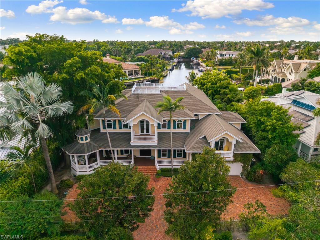 Aqualane Shores Estate | Long Western Views of the Kite Cove  | Deep Water Direct Gulf Access | No Flood  Damage. Set on an oversized 16,550+ sq.ft. (lot size 111x150 )cul-de-sac location with no-bridge Gulf access, this property delivers one of the strongest values in Aqualane Shores. 
The long, wide western views over Kite Cove are the kind of sightlines that rarely come to market—especially at this price point.
Built in 2003 and spanning over 5,300 Sq. Ft. under air for a total of 8,392, the home combines timeless architecture with modern livability. It offers five bedrooms, five full baths, one half bath, formal living and dining rooms, a library/den, media room, home office, gym, music room, and a full VIP suite with walk-in closets and a kitchenette.
The chef’s kitchen is designed for serious cooking and entertaining, featuring granite countertops, a center island, pantry, breakfast bar, gas cooking, double ovens, and premium appliances.
Outdoor living is a major highlight: a resort-style pool and spa, wrap-around terrace, multiple balconies, and mature tropical landscaping—all oriented to capture dramatic western sunsets over the water. For boaters, the setup is turnkey and rare: a slip for a 32-foot vessel, an 18,000-lb lift, and fast, direct access to the Gulf.
A true standout in one of Naples’ most sought-after waterfront neighborhoods.