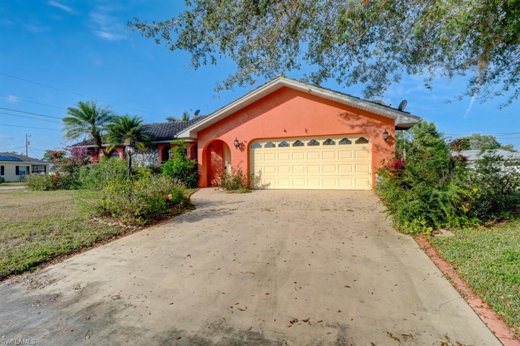 You won't wan to miss this opportunity to own a gorgeous 3 bedroom 2 bath 2 car garage home on a corner lot in the beautiful Lehigh Acres!  In the desirable Country Club Estates, this home has new stainless steel appliances and flooring.  Not sure about the paint colors?  The seller is offering interior paint changes to be done before you move into your new home, pick your colors!  The sliding glass doors open onto almost a 1/4 acre lot.  Lehigh Acres is close enough to the Gulf that a beach day is possible any day, its also perfectly situated for fishing and hunting enthusiasts.  You won't want to miss out of Lehigh's championship golf courses either!  See what Florida has to offer!