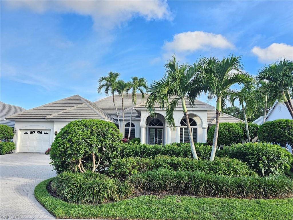 Lovely home with a bright southern exposure. Situated on the 700 block in Oakmont steps to the walking path and Oakmont lake. Interior features include a bright open floorplan, volume ceilings, 8 foot doors, updated kitchen, flooring and baths. Exterior features include a screened lanai with pool and spa overlooking lush tropical flora. Pelican Bay amenities include miles of walking paths, three miles of beachfront with two private pavilions. Kayaks, canoes and sunfish, Fitness center, 18 tennis courts and pickleball. All for resident use. Centrally located between the upscale Waterside Shops, Restaurants and the Ritz Carlton Beach Resort. The is Florida Resort living at its best.