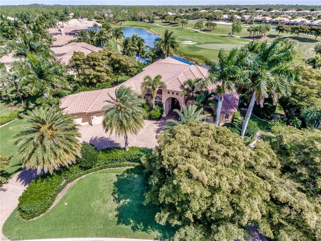 This home has everything you could want from breathtaking lake and golf course views, open floor plan with a spacious kitchen and family room which opens seamlessly to the outdoors with 90 degree pocketing sliding doors. Situated on one of the largest lots in Shadow Wood with $68k in additional landscaping creating complete privacy. Your guest will love and appreciate the massive guest suites.  Virtually every high-end upgrade available is included; hurricane impact glass, 30kw generator which will run the entire home, 500-gallon propane tank (optional natural gas hookup available) instant hot water throughout, HVAC systems replaced in 2016, Wolf, Sub-Zero and Bosch appliances, Kitchen Craft cabinetry throughout, travertine marble tile in all living areas and much more. The lot is perfectly situated with a central view of a long lake and the 13th green looking all the way down the lake and golf course, you see nothing but water and golf course. The spacious lanai offers both plenty of sitting space both sunny and shaded, an infinity-edge pool, spa, large sundeck, outdoor kitchen with built-in grill, fridge, running water and large bar area is everything you could want.