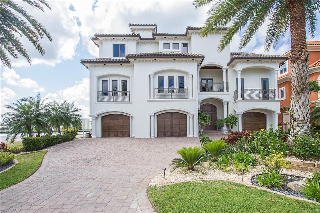 BEACH, BAY, BOATING... located in the coveted, three finger streets directly off of GULF SHORE DR., surrounded by lush landscape sits this Magnificent Waterfront Estate Home. Location... Location...directly off of GULF SHORE DR.-Across the street from Vanderbilt Beach (voted in the top 10 beaches 6 years running). This 5-bedroom Estate Home with spectacular BAY VIEWS extending to all rooms and ATTENTION TO DETAIL is sure to please your most discerning buyer. This luxurious gem has 5,860 square feet of living space, a spacious 4 car garage, an inviting large & open great room, sparkling infinity edge pool/spa, marble floors, high end Wolf/Subzero Appliances, office/exercise room Plus Deeded beach access .THIS HOME TRULY HAS IT ALL! When you are not enjoying your BAY VIEWS from your expansive balconies or lanai, take your boat out from your own dock with lift to the warm Gulf Waters, walk to enjoy fine dining at the Turtle Club, La Playa or shop at Mercato Center, sink your toes into the sugar sand at Vanderbilt Beach, plus only 30 minutes to airport.  Make your DREAM of a beach & boating lifestyle in this elegant yet easy living home COME TRUE! Must be seen to be appreciated!