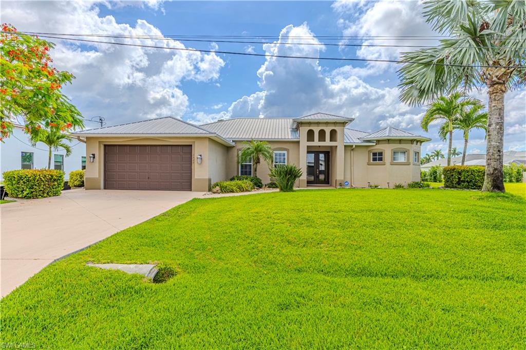 Welcome to one of the most sought-after locations in Cape Coral’s highly desirable Surfside Corridor! Perfectly positioned near the coast, this exceptional pool home captures the relaxed Southwest Florida lifestyle with refreshing sea breezes, beautiful surroundings, and convenient access to everything Cape Coral has to offer. This 3 bedroom, 2 bathroom plus large den POOL home is situated within an established, family-friendly neighborhood known for its strong sense of community and pride of ownership, this meticulously maintained residence offers the perfect combination of quality craftsmanship, thoughtful design, and modern comfort. Built by the highly respected Tundra Homes, you’ll immediately notice the superior construction and upscale finishes that set this home apart. Step through the front entry and into a bright, open-concept floor plan featuring elegant tray ceilings, spacious living areas, and a seamless flow that’s perfect for both everyday living and entertaining. The inviting living room transitions effortlessly into the beautifully designed kitchen, creating a warm and welcoming atmosphere throughout the home. The spacious owner’s suite serves as a private retreat, complete with tray ceilings, generous walk-in closets, and a luxurious spa-inspired bathroom. Enjoy dual vanities, spa seating, a Roman soaking tub, and a unique walkthrough shower that creates a true resort-style experience. The guest bedrooms are thoughtfully sized and each features its own walk-in closet, providing comfort and functionality for family and visitors alike. Step outside to what may become your favorite part of the home—the expansive screened lanai featuring a custom heated pool and spa. Whether you’re enjoying a quiet morning coffee, hosting friends and family, or relaxing under the Florida sunshine, this outdoor living space is designed to be enjoyed year-round.
Beyond its beauty, this home offers outstanding peace of mind with a metal roof, newer pool heater, generator hookup, and city water and sewer already in place with ALL ASSESSMENTS PAID. The home’s storm-ready features and exceptional upkeep make it as practical as it is attractive. As an added bonus, the property includes an existing transferable flood insurance policy, offering potential savings and convenience for the next owner.
From the moment you pull into the driveway, you’ll feel the warmth, character, and pride of ownership that make this home truly special. Rarely does a property in this condition and location become available. If you’re searching for a move-in ready home in one of Cape Coral’s premier neighborhoods, this is an opportunity you won’t want to miss. Schedule your private showing today and experience firsthand why this is one of the finest homes available in the area.