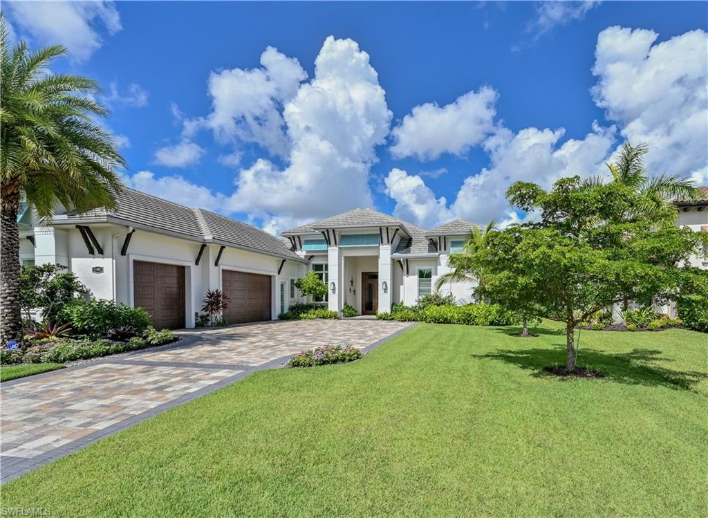 Miromar Lakes waterfront home with exquisite detail & luxury finishes. Entrance leads to open concept showpiece with cloud & custom ceilings, wood floors, Chef's gourmet island kitchen, dining area with built-in cabinetry - dry bar & wine cooler that adjoins expansive living area. Living & dining areas open to outdoor living.  Four en-suites include luxurious mstr with sitting area & bdrm Suite with access to lanai.  Den, half-bath, walk-in pantry & laundry room with counter, sink & addl refrigerator complete interior.  The magnificent expanded lanai offers a covered area & open air fenced area.  Features include pool bath, dbl sided fireplace between sitting area & spa, pool with sun shelf, outdoor kitchen with built-in gas grill - refrigerator & sink, oversized island for entertaining & gas fire pit.  Private dock has electric, water & boat lift.  Hurricane screens & shutters on lanai.  Boat - fish - ski - paddle board from dock on over 700 acres of fresh-water lakes.  Miromar Lakes amenities include restaurants/bars, infinity pool w/spa, tennis, bocce, pickle ball, sand beaches, full service spa & fitness & more!  Golf mbrships available.  Come live the Miromar Lakes lifestyle!