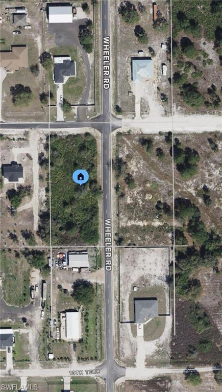 FRESHLY PAVED ROAD! In front of a new construction home. With power at the curb. Corner lot located off of the Wheeler Road Subdivision. Soon will have access to SR80. Financing available for qualified buyer with significant down payment. Priced below market value and the only corner lot under $60,000. No wetlands. Hablo Español