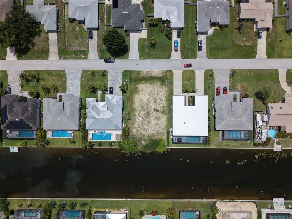 Build your future home on this freshwater canal lot located at 3315 SW 30th Street in Southwest Cape Coral. The property offers peaceful canal views and desirable eastern exposure, allowing you to enjoy morning sunlight from the rear of your future home while providing more comfortable afternoon enjoyment of the outdoor living area. Conveniently located near shopping, dining, recreation, and other Cape Coral amenities, this vacant residential lot offers an excellent opportunity to create a primary residence, seasonal retreat, or investment property designed to fit your needs.