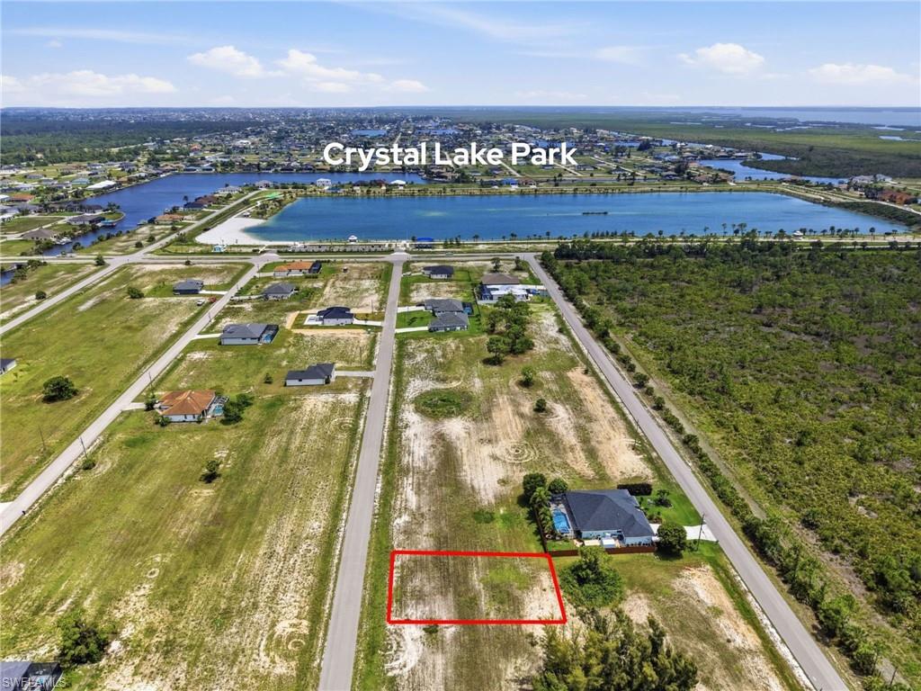 Come and build your dream home on this gorgeous lot surrounded by beautiful new construction in one of the most desirable areas of Northwest Cape Coral! Just steps from your future home, you'll enjoy the incredible Crystal Lake Park, featuring a sandy beach, playground, boat and kayak launch, fitness stations, walking trails, boardwalk, picnic areas, and stunning waterfront views. This cleared, ready-to-build lot is located in a rapidly growing neighborhood filled with newer homes and exciting future development. Enjoy the perfect blend of privacy, tranquility, and convenience, while being just minutes from Publix, schools, restaurants, Burnt Store Road, Tranquility Lakes RV Resort, and the highly anticipated Seven Islands Project. Whether you're ready to build your dream home today or looking for a smart investment opportunity, this property offers exceptional potential in a thriving area with endless possibilities. Don't miss your chance to be part of the exciting growth happening in Northwest Cape Coral—you'll absolutely LOVE living here!