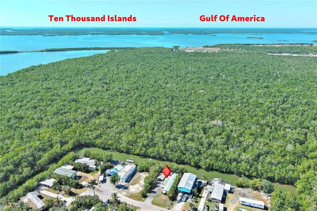 Exceptional waterfront opportunity on Plantation Island offering direct access to the Ten Thousand Islands and Gulf waters.

This well-maintained 3-bedroom, 2-bath residence is thoughtfully equipped for boating, fishing, and relaxed coastal living. The property delivers the functional improvements serious waterfront buyers value most.

The aluminum floating dock, constructed with stainless steel hardware, provides water and electric service at the slip. A covered, screened fish-cleaning station with lighting enhances usability for avid anglers. The mangrove-lined canal offers privacy and quick access to world-class backwater and offshore fishing.

Exterior improvements include:

• Detached aluminum carport suitable for boat and vehicle storage (or two vehicles)
• Spacious concrete driveway with ample parking
• Connected tool/workshop room with built-in bench space
• Additional outdoor storage shed
• Expansive screened lanai with excellent lighting and airflow
• Enclosed side utility room off the lanai with refrigerator for added convenience
• Storm shutters surrounding the residence
• Aluminum awnings for sun and weather protection

Interior features include:

• Updated Vinyl plank flooring throughout
• Updated drywall and trim
• Updated Soft-close hardwood cabinetry
• Updated Formica countertops
• Renovated primary bathroom featuring a large tiled walk-in shower
• Guest bath with tub/shower combination
• Walk-in closet in primary suite
• Interior laundry/storage space

A metal roof approximately seven years old provides durability and peace of mind.

Future Potential:
Per the owner of the adjacent vacant parcel, purchase of the neighboring lot may be an option, creating expanded development flexibility. Recent code updates now allow construction of single-family homes on Plantation Island (buyer to verify zoning and use). A grant has also been approved for municipal sewer expansion to Plantation Island, offering long-term infrastructure enhancement for the community (buyer to verify timeline and availability).

Whether utilized as a primary residence, seasonal retreat, redevelopment opportunity, or dedicated fishing getaway, this property offers both immediate waterfront enjoyment and long-term potential.

Bring your boat — and bring your vision.