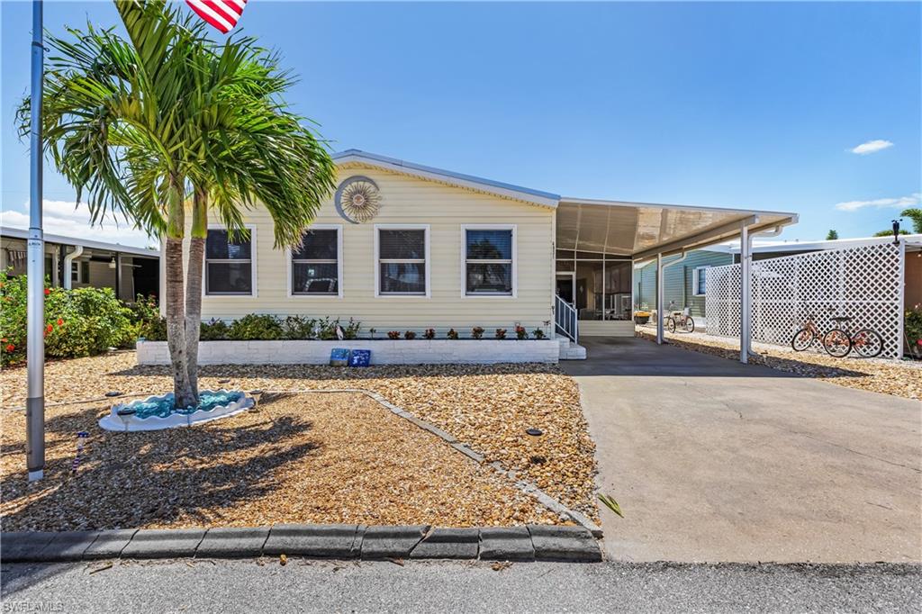 Pine Island Cove 55+ community.. Community POOL, HOT TUB, CLUBHOUSE, FITNESS, PICKLE BALL, PICNIC- PARK BOAT RAMP, BOAT & RV STORAGE, SEWER and much more.. Beautiful Island Community.  The 2-bedroom 2-bath 1152 sq ft home is very well cared for and has been a year around home with HURRICANE WINDOWS THROUGH OUT - wood paneled living & family room, updated-kitchen and carpet & laminated floors. Storage/shop, Carport & screened area. Out door life is part of Pine Island Cove...Friends, pickle ball, pool a 16 mile long bike path up & down the Island. The boat ramp will put you and your boat into the Cove canal and out to Pine Island Sound for the best fishing, out-Island beaches, the Gulf for you to enjoy... Visit Pine Island Cove and this wonderful home today !!!!!