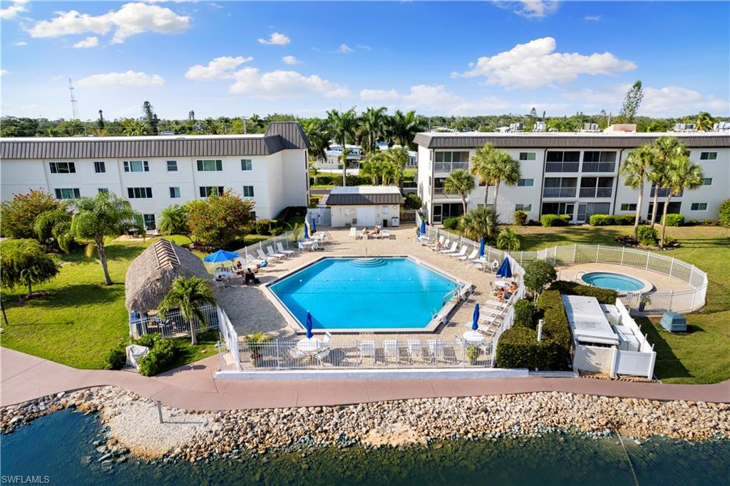 Discover easy Southwest Florida living in this beautifully updated first-floor condo featuring 2 bedrooms and 2 bathrooms. Thoughtfully renovated throughout, this move-in ready residence offers stainless steel appliances, quartz countertops, tile flooring, fresh interior paint, and an open, contemporary feel. The screened lanai overlooks partial lake views, creating the perfect setting to enjoy your morning coffee or unwind at the end of the day.
Additional highlights include in-unit laundry and assigned parking for added convenience.
Located in the desirable Gulf Winds East community, residents enjoy an impressive array of amenities including a resort-style pool and spa, tennis and pickleball courts, bocce ball, and a BBQ/picnic area. Ideally situated between Naples and Marco Island, you'll have easy access to world-class beaches, shopping, dining, golf, and entertainment. Whether you're looking for a full-time residence, seasonal retreat, or investment opportunity, this exceptional condo offers the best of Southwest Florida living.