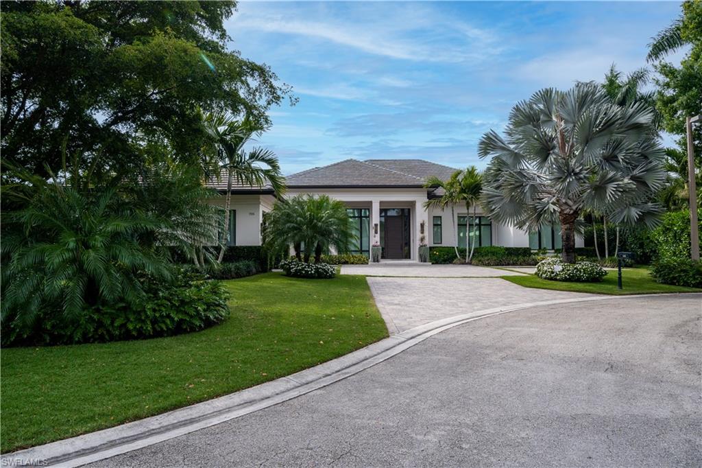 H5101 - Breathtaking lakefront coastal contemporary estate. Four en suite bedrooms, an indoor and an outdoor great room, family room, kitchen, office, butler’s pantry, and 3 car garage all over look a gorgeous water view. Situated on the cul-de-sac on a quiet street in Pelican Bay, moments from Waterside, Artis Naples, Mercato. Pelican Bay offers miles of sandy beach, 2 beach clubs with dining, cocktails, and beach service; a competitive tennis program; paddleboards, kayaks, fitness center, and the brand new Club Pelican Bay featuring award-winning restaurants, 27 holes of golf, member fitness center and spa.