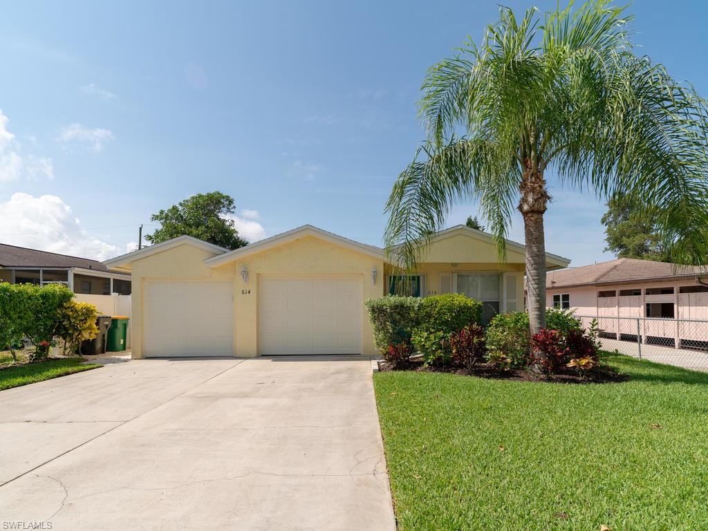NAPLES PARK short walk to Vanderbilt Beach and it's white sand, less then a mile to Mercato featuring all the best shopping, dining and entertainment, a quick car ride to 5th Ave galleries, shops, dining and entertainment and many more! Large driveway and a 2 car garage! This 3 Bedroom, 2 Bathroom Single Family home with fenced in yard offering an open and spacious floor plan, oak cabinetry in the kitchen and baths. All this plus MUCH more! Situated upon a lushly landscaped fenced lot with fruit trees and well for irrigation in the highly sought after neighborhood of Naples Park! Amazing rental potential for the smart investor! Come live the SWFL lifestyle to the fullest here!