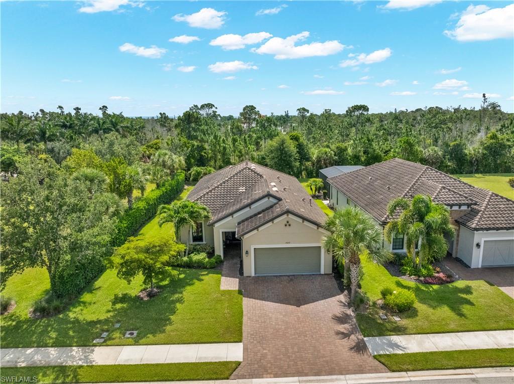 What a hidden gem this natural gas community surrounded by shops and restaurants but yet still set in nature and surrounded by beautiful preserve and nature paths. NOT IN A FLOOD ZONE. Estero pointe offers low HOA fees and everything is taken care of in this Taylor Morrison built community. If you love an automated home stop looking as this Farnese floor plan has it all. 3 bedroom plus a den with every bedroom offering an En-suite bath. Major upgrades on this home are the extensive automation this home offers with controlled lighting and speaker system throughout for your convenience as well as automated shades in living area and media room/den. Insulated garage is another great feature with extra overhead storage racks. Priced to sell. Highest elevation in the community and large lot with extra privacy and a very spacious yard you can add a pool if you chose but you are only a very short distance to the community pool. Beautiful preserve view add some additional privacy. Large overhang on your screened in lanai lets you enjoy those beautiful Florida days. Large Island with quartz counters and stainless steel appliances, walk in pantry with custom cabinets and plenty of barstool seating around the island. Open floor concept with living and dining in same room. Large primary bedroom with bay window and updated flooring leading into your spacious En-suite with large walk-in shower with frameless glass door and oversized walk-in closet and separate WC. Other two guest bathroom en-suites offer a shower tub combo and single vanity. Another powder room/ half bath is convenient for entertaining. Large laundry room with folding station, front load appliances and overhead storage. A must see and you don't want to miss this opportunity right on the Estero City limits. Estero pointe offers a community pool and is gated.