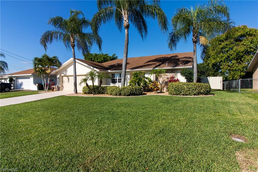 WOW... Check it out! Large (2000+ sqft) fenced pool home in the well-established quiet and safe family Pelican neighborhood! Don't let the age of the home fool you! This freshly painted home has been remodeled and has 3 bedrooms + DEN with 3 other living areas, one of which is being used as a movie room (theater screen and projector convey with the house). Large guest bath also acts as a pool bath. Tile in the main rooms and carpet in bedrooms. Granite kitchen with beautiful soft close cabinets and NEW black stainless steel appliances (8/2018). New variable speed pool pump and cleaner in 2018. Privacy fenced was installed in 2017 and a high-efficiency water heater in 2015. It has an extra large shed, firepit, and playset in the backyard. Garage has added suspended shelves for storage. Mature landscaping with curbing around the house. Pelican soccer fields and baseball fields are just up the street with the elementary school just a few minutes away. This beautiful home is close to restaurants, shopping, schools and in between the bridges for easy access to Fort Myers. Schedule your appointment to see it today before it's gone!