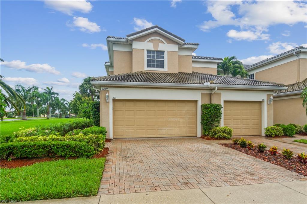 Beautiful lakefront corner unit.  Formally a model when these homes were being built.  Crown molding, custom mirrors, and numerous built-ins throughout the home.  Features an open floor plan with high ceilings, staircase leads to the spacious great room/dining area.  Large screened in lanai, facing south.  Kitchen has hard surface counter tops, tiled backsplash, stainless appliances.  The cozy breakfast nook is off of the kitchen over looks the lake.  Three spacious bedrooms, plus a den with built in bookshelves.  Laguna Lakes has beautiful walking paths among acres of sparkling lakes, a beautiful clubhouse with resort style pool, spa, billiards, exercise room, tennis courts, volley ball,  play area, and fishing pier. Very close to Sanibel and Fort Myers Beaches.   Plenty of options for shopping and restaurants.  Showings on Saturday-Sunday 9-4