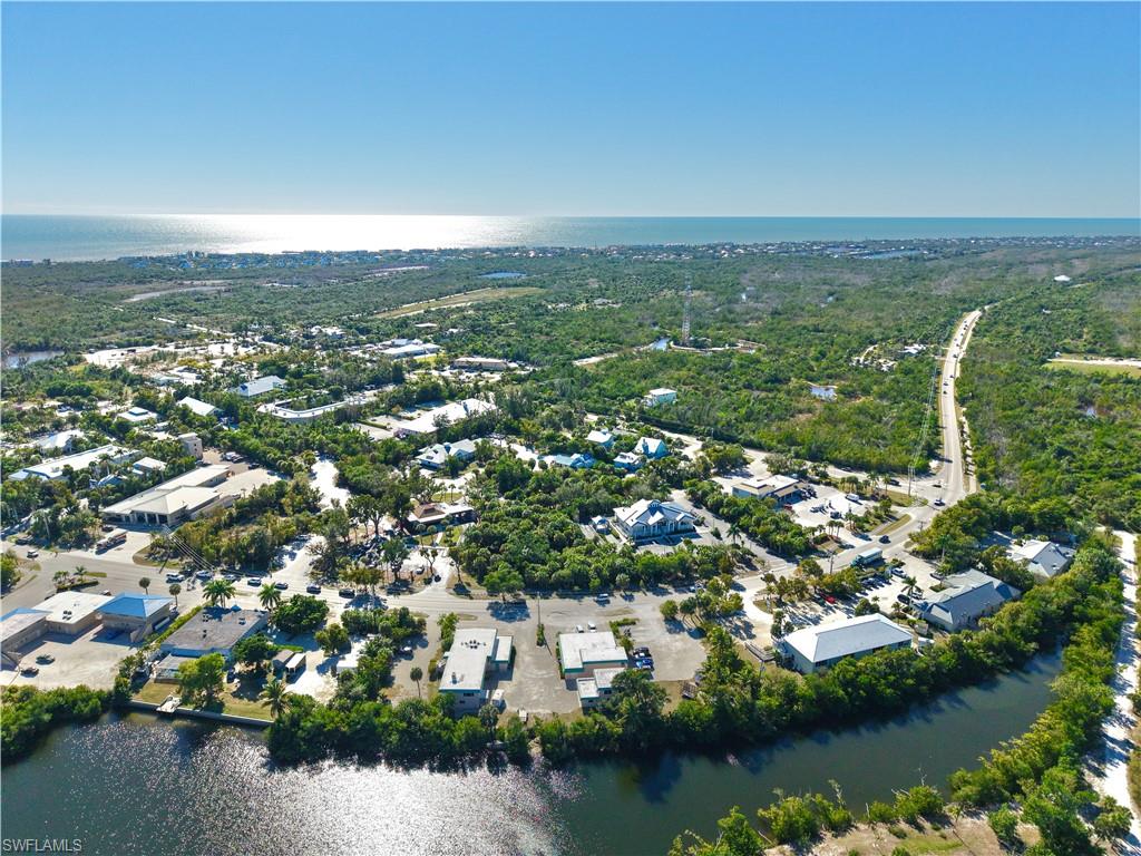 Exceptional mixed-use investment opportunity in the heart of Sanibel Island’s Town Center Commercial District.Situated on highly traveled Palm Ridge Road, this unique property offers outstanding visibility, a consistent incomehistory, and the rare combination of commercial frontage with scenic lake views and tropical wildlife surroundings.The property consists of three buildings featuring seven remodeled residential apartments and six establishedcommercial units, along with two separate garage/storage rentals providing additional income. Several residentialunits enjoy peaceful lake views, enhancing tenant appeal. The residential component includes seven bedrooms andseven bathrooms, while the 6 commercial spaces are equipped with eight half-bathrooms, allowing for flexibleconfigurations suited to professional, retail, service, or live-work uses. This asset has a proven track record as anincome-producing property and has previously been utilized by the City of Sanibel, underscoring its versatility andlong-term value within the community. Ideally positioned with convenient access to Captiva and all areas of Sanibel,the property is located within one of the island’s most established and desirable commercial corridors. Occupancyhas remained consistently strong, with all commercial units currently leased and all but one residential unit occupied.Detailed rent rolls and financials are available to qualified buyers. For investors seeking to be part of the early stagesof Sanibel and Captiva’s resurgence, this property offers a rare opportunity to acquire a stabilized, income-producingasset while positioning for the next chapter of growth, revitalization, and long-term appreciation in one of SouthwestFlorida’s most iconic island markets.