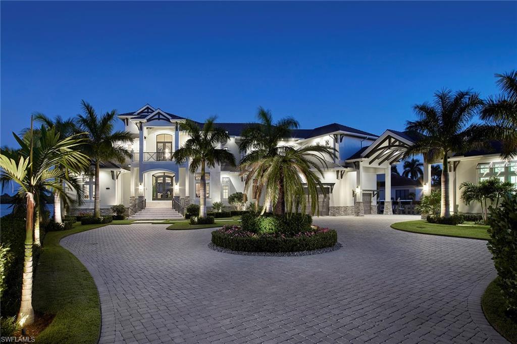 The address is coveted. The legacy is yours forever. Marco Island hasn’t seen a new, luxury residence of this caliber and special location in 15 years. The spectacular tip-lot-and-a-half on one-half-acre enjoys nearly 470’ of direct frontage on Collier Bay that is just minutes to all that makes Marco Island a world-class destination. One of only three waterfront locations within Hideaway. The elegant design of coastal sophistication over three levels is setting the new standard for island luxury with great room-style plan with six suites (two masters), two kitchens, theater room, elevator, incredible entertaining opportunities and easy access to outdoor living spaces. Stunning views abound from nearly every room but perhaps the best place from which to drink them in is the infinity-edge pool and spa which are surrounded by an expansive terrace. Whole-home generator, porte-cochere and two a/c garages. Incredible docking facility with tons of room, slip & 2 Waverunner lifts. The home is located in Hideaway Beach which is a gated, picturesque community that offers over two miles of beach, dining, privacy and seclusion in an island paradise. Setting the new standard for island luxury!