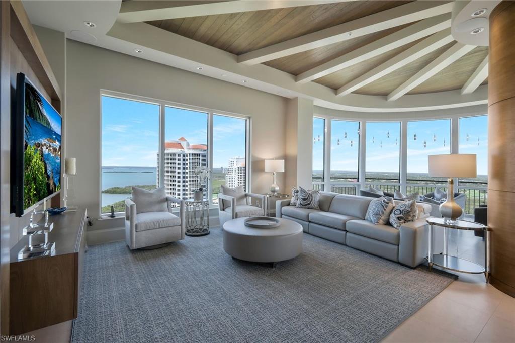 One of the most unique and stunning homes in all of Bonita Bay! ABSOLUTELY GORGEOUS with an esteemed PRIVATE TWO car garage - overlooking the Estero Bay and Gulf of Mexico! This home is pure sophistication and luxury! Located in the desirable Tavira high rise building, "move right in" to this exquisite home in the sky. This home's talented designer/owner lovingly designed the space - a true masterpiece! No expense was spared with the beautifully designed interior - from the ceiling details to the flooring to the state of the art kitchen. The dual secure coded elevators open to a private foyer leading into an elegant open-concept living space adorned with high-end exquisite finishes, a fireplace, and multiple balconies. Additional features include stunning kitchen cabinets, quartz counter-tops, a custom bar area, GORGEOUS lighting, VOLUME ceilings with extra height,  a stunning primary suite, split bedrooms, several outdoor spaces and so much more. Entertain friends & family in this elegant (yet comfortable) home. This home is meant to be enjoyed - a true spiritual retreat! Tavira is one of Bonita Bay's most esteemed high rise buildings. Amenities include a beach park, nature trails, a marina and optional club membership including golf, tennis, several restaurants and a fitness center. All this and a PRIME location within Southwest Florida, close to world renowned beaches, restaurants, the burgeoning downtown Bonita Springs and the Southwest Florida Airport! Do not hesitate as homes in Bonita Bay like this one RARELY become available! Be sure to view the accompanying video of this home!