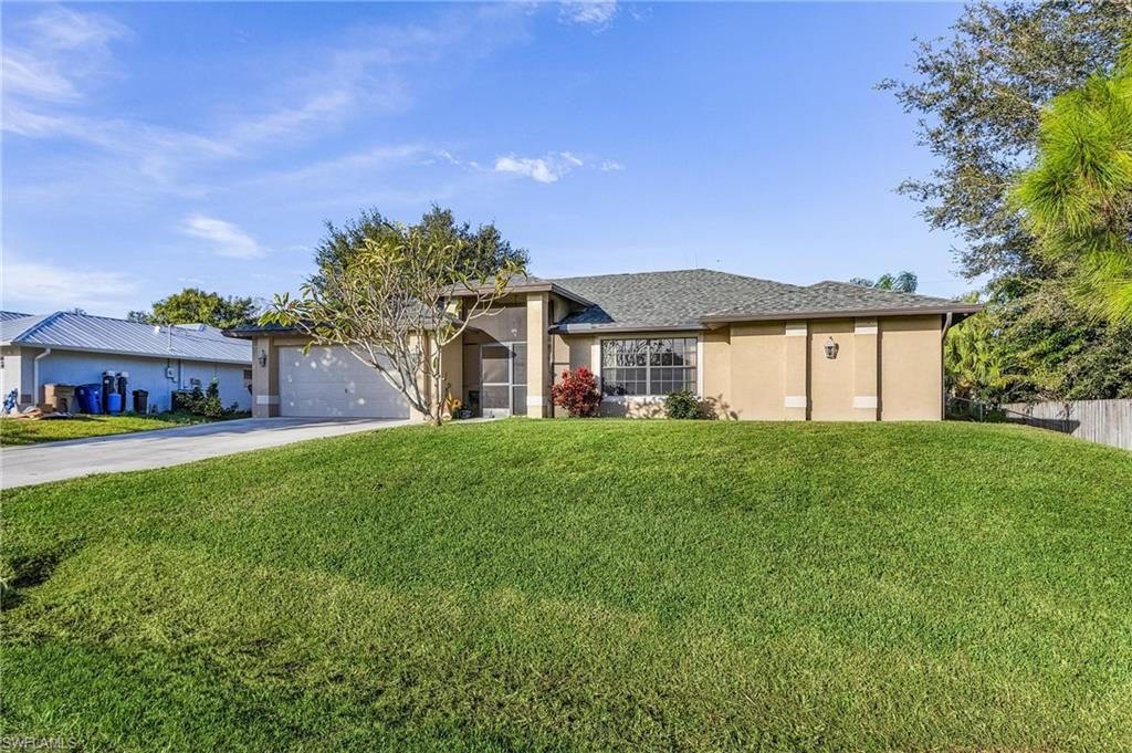 Welcome to this charming River Oaks residence in Alva, featuring 4 bedrooms, 2 bathrooms, with an attached 2-car garage with NO HOA fees. This neighborhood offers all the perks of a community(holiday parades, parties and more) without all the fuss and fees. Conveniently located near shopping, restaurants, schools, parks, and a boat ramp. As you step inside, be amazed at the expansive 2000 square foot floor plan. A roomy kitchen with a breakfast bar, indoor laundry room, split floor plan, walk in closets in two guest bedrooms and the primary bedroom are just some of the wonderful features of this home. One bedroom can easily be converted to a media room or office. Upgrades to this home include a brand-new roof 2023, new air conditioning units 2022, new kitchen appliances, generator hook up, outdoor security cameras, and hurricane shutters providing both comfort and peace of mind. Embracing a rural ambiance, the property boasts a fenced backyard with tropical landscaping for privacy on your large screened lanai. Come see this amazing home in a wonderful community before it is gone!