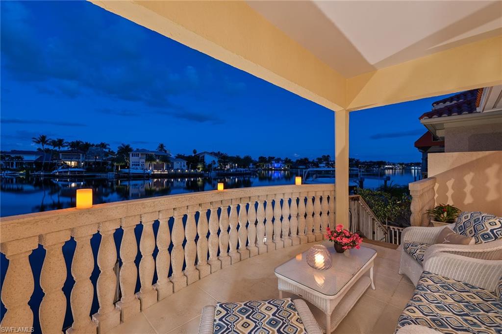 Presenting an extraordinary opportunity to own this one-of-a-kind single-family residence situated directly over Venetian Bay. This three-bedroom, three-and-a-half-bath home features panoramic bay views and incredible spaces both inside and out. Entertain in the grand living room with its soaring ceilings and veranda overlooking the bay or enjoy more intimate gatherings in the large great room, which is framed with endless views, a wet bar with wine cooler, custom ceiling work and a large built-in media center. The eat-in kitchen is bright and neutral with white cabinetry and quartz countertops. The inviting owner’s suite showcases incredible views in both its bedroom and bath and offers access to both the open-air veranda and pool deck. The home’s front courtyard is serene and inviting with its tranquil pool/spa, lush landscaping and two seating areas. Out back, one will enjoy fresh air and bay views from the open-air verandas or relax by the water’s edge on the oversized dock. With private beach access across the street and Venetian Village just steps away, this special home will truly impress with its exceptional qualities.