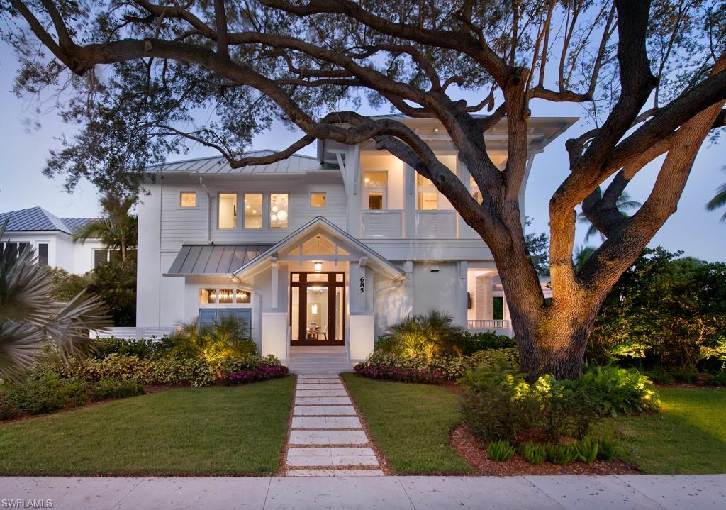 Situated on a south exposure corner lot that is two blocks from the beach, and a few short blocks to the renowned shopping and dining of 5th Ave South and 3rd St South!  MHK Architecture has designed an Old Florida cottage with all the modern amenities of today, positioned in this irreplaceable “golden triangle “ location.  Control 4 automation, subzero and wolf, French white oak flooring, honed marble countertops and split-faced marble accents inside and outside. First level master suite and four graciously designed, light-filled en-suite guest rooms upstairs, including a loft/2nd floor living area.  Beautifully appointed and furnished by Broad Avenue Designs, this is an unbeatable option in downtown Old Naples.