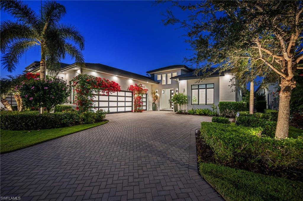 Immediate golf and Gulf access await at 1671 Vineland, a stunning ranch-style home built in 2019, perfectly situated on the picturesque second and third holes of the Bear's Paw golf course, steps away from a private deeded boat slip. This exceptional residence offers breathtaking golf course views, best enjoyed from the private pool and spa, along with the spacious 400-square-foot covered outdoor living area. Featuring powered screens, a vented natural gas fireplace, and a vented Weber six-burner natural gas BBQ, the lanai provides year-round comfort and is ideal for entertaining or relaxing. A bar sink and a conveniently located U-Line undercounter bar refrigerator (servicing both the kitchen and lanai) further enhance the outdoor experience. With ten-foot sliding glass doors, the home seamlessly blends indoor and outdoor living. Inside, a thoughtfully designed great room centers around a spectacular chef’s kitchen that will impress even the most discerning culinary enthusiast. Highlights include Sub-Zero refrigeration with a full refrigerator featuring a cold water dispenser, a separate freezer with an ice maker, and a Sub-Zero wine tower with two refrigerated drawers. The kitchen is equipped with premium Miele appliances, including an induction cooktop, speed oven (microwave and convection), steam oven, warming drawer, built-in coffee maker, and two Miele dishwashers. A transom backsplash, expansive windows, and a large pantry flood the space with natural light while providing excellent storage and functionality. The home offers three spacious bedrooms, each with its own en-suite bathroom, plus a dedicated den perfect for a home office or additional guest space. Overall, there are three full bathrooms, a powder room, and a pool bath, all thoughtfully designed for convenience and privacy. Car enthusiasts will appreciate the oversized three-car garage, offering nearly 900 square feet with a five-foot bump-out, impact-rated high garage doors, and ceiling heights that accommodate car lifts. Additional features include an Electrolux front-loading washer and steam dryer. An immediate golf membership is available for purchase at closing, allowing a seamless transition into the Bears Paw lifestyle. The property is mostly furnished, with a detailed list of inclusions available upon request. This is a rare opportunity to own a meticulously designed, newer-construction home in the exclusive Landings at Bear's Paw, centrally located in Naples with unmatched access to world-class golf, dining, and beaches. Act quickly—homes of this caliber rarely become available. Membership to Bears Paw is optional.