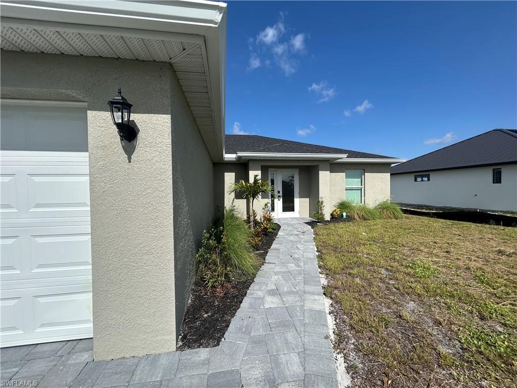 Brand new 4-bedroom, 2-bath home in Cape Coral offering modern, never-lived-in construction and fresh finishes throughout. Main living areas feature tile flooring while the bedrooms are carpeted for added comfort. The primary suite includes a walk-in closet and a walk-in shower. An inside laundry room comes equipped with a washer and dryer. Large windows and an open layout provide views overlooking a fresh water canal, creating a bright, airy atmosphere ideal for relaxed living. Stainless steel appliances and granite counter tops make this a great place to call home !Small pet considered with non refundable fees.