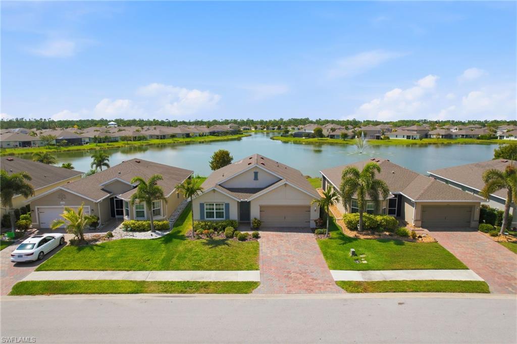 Set on a premium homesite with a wide, uninterrupted long lake view, this residence captures one of the most desirable vantage points in Cape Coral’s Entrada community, where water, sky, and sunsets become part of your everyday backdrop. Perfectly positioned within the neighborhood for both privacy and convenience, the location offers easy access in and out while still feeling tucked away. Inside, the home is designed to highlight that view, with a light-filled, open layout that draws your eye straight through the main living spaces to the water beyond. The kitchen anchors the home with clean, modern finishes, generous cabinetry, and a functional breakfast bar, ideal for casual mornings or hosting with ease. The primary suite is a quiet escape, thoughtfully oriented to take full advantage of the lake, and complemented by a spacious walk-in closet and a well-appointed ensuite bath. Three additional bedrooms offer flexibility for guests, a home office, or growing needs without sacrificing comfort. And for added peace of mind, the home is equipped with hurricane shutters. Living in Entrada means enjoying a well-located Cape Coral address paired with exceptional value, offering resort-style amenities including a pool, clubhouse, fitness center, tennis, pickleball, and more, all with notably low HOA fees. This is a property where the view and location do the talking, a rare combination that elevates everyday living.
